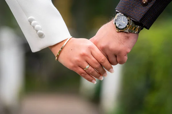 Loving couple holding hands