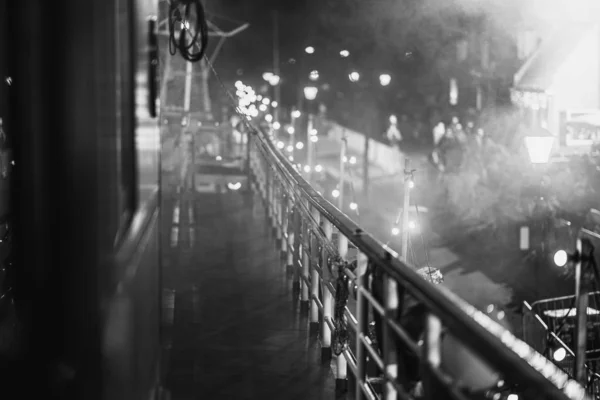 Classic cruise ship with wooden reeling on the quayside of a har