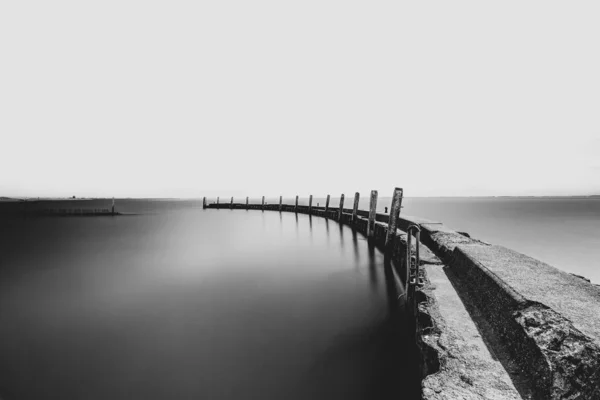 Storm surge barrier breakwater. Concrete block breakwater in por — Stock Photo, Image