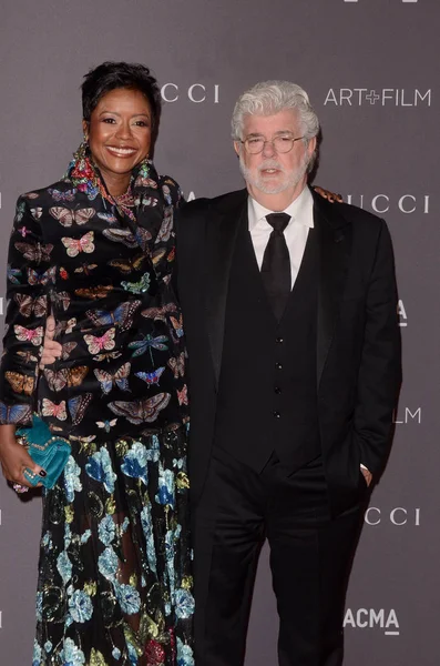 Businesswoman Mellody Hobson with film director George Lucas — Stock Photo, Image