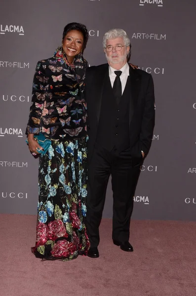 Businesswoman Mellody Hobson with film director George Lucas — Stock Photo, Image