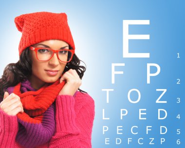 woman in glasses and test vision table clipart