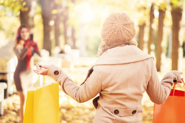 Beautiful young women in autumn park — Stock Photo, Image