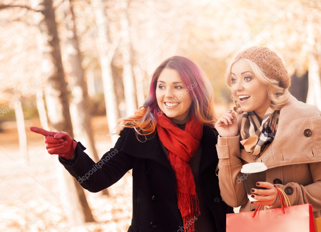 Beautiful young women in autumn park