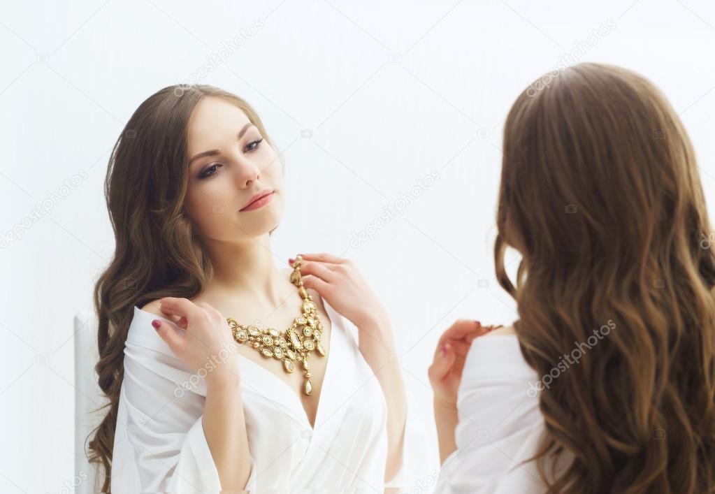 woman trying jewelry