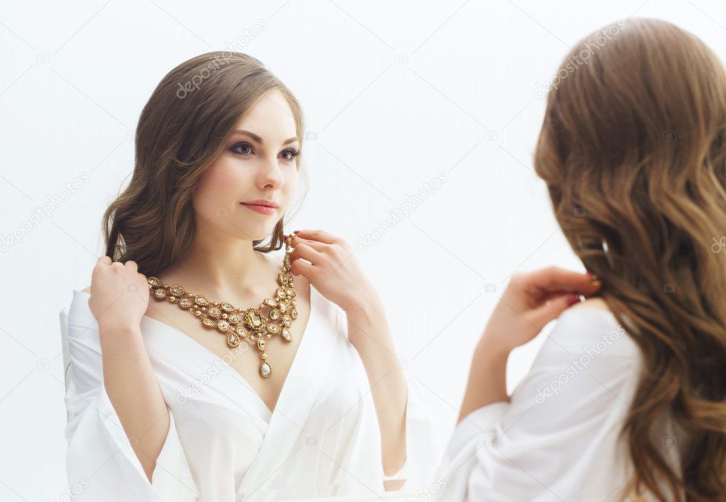 woman trying jewelry