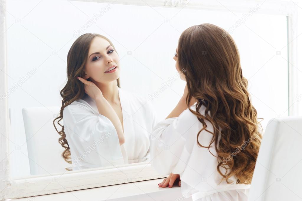 girl looking at mirror