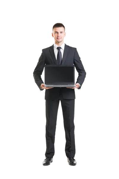 Jovem e confiante empresário segurando laptop — Fotografia de Stock