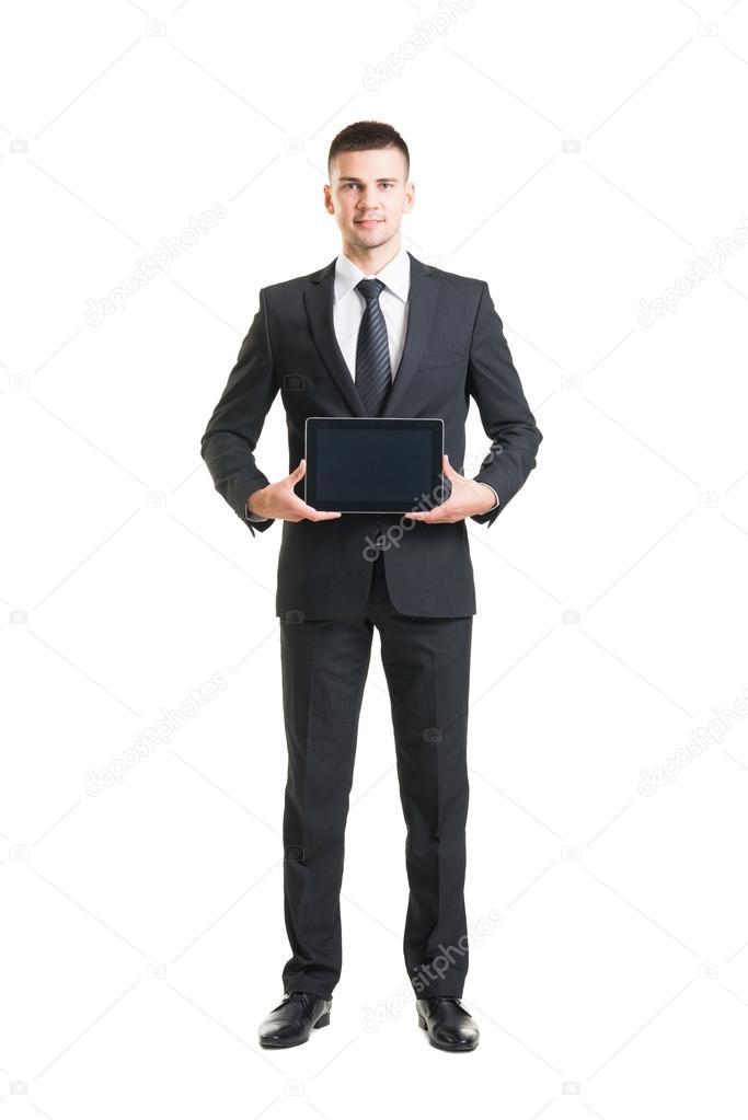 Young and confident businessman with digital tablet