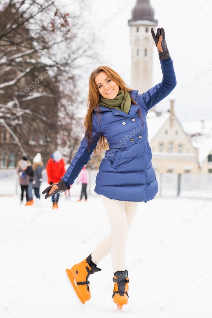 Young and pretty woman skating 