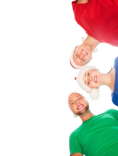 Group of young people in Christmas hats — Stock Photo, Image