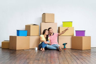 happy couple moving to new home clipart