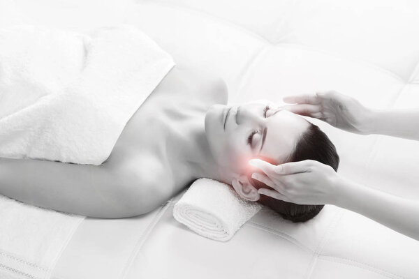 Young woman on massage therapy procedure