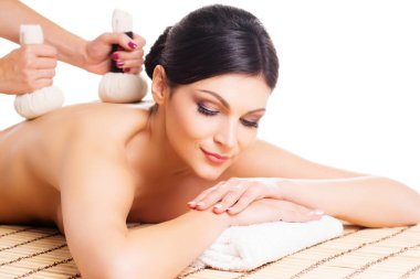young and natural woman on spa massage  clipart