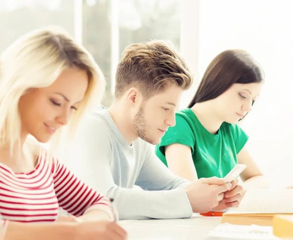 Group of students studying at lesson — Stock Photo, Image