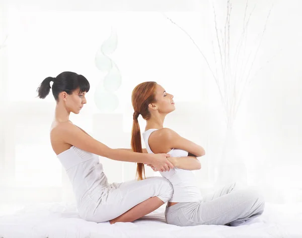 Woman getting thai stretching massage — Stock Photo, Image