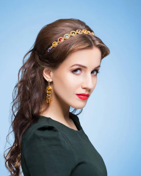 Young beautiful woman in jewelry — Stock Photo, Image