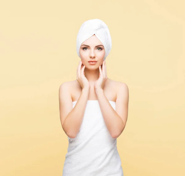 Young woman wrapped in towel — Stock Photo, Image