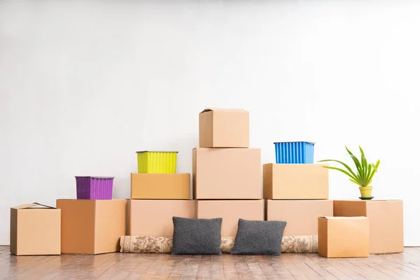 Pile of cardboard boxes on floor — Stock Photo, Image