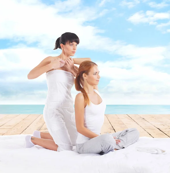 Woman getting thai stretching massage — Stock Photo, Image