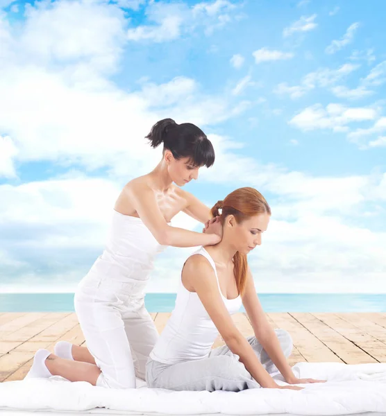 Woman getting thai stretching massage — Stock Photo, Image