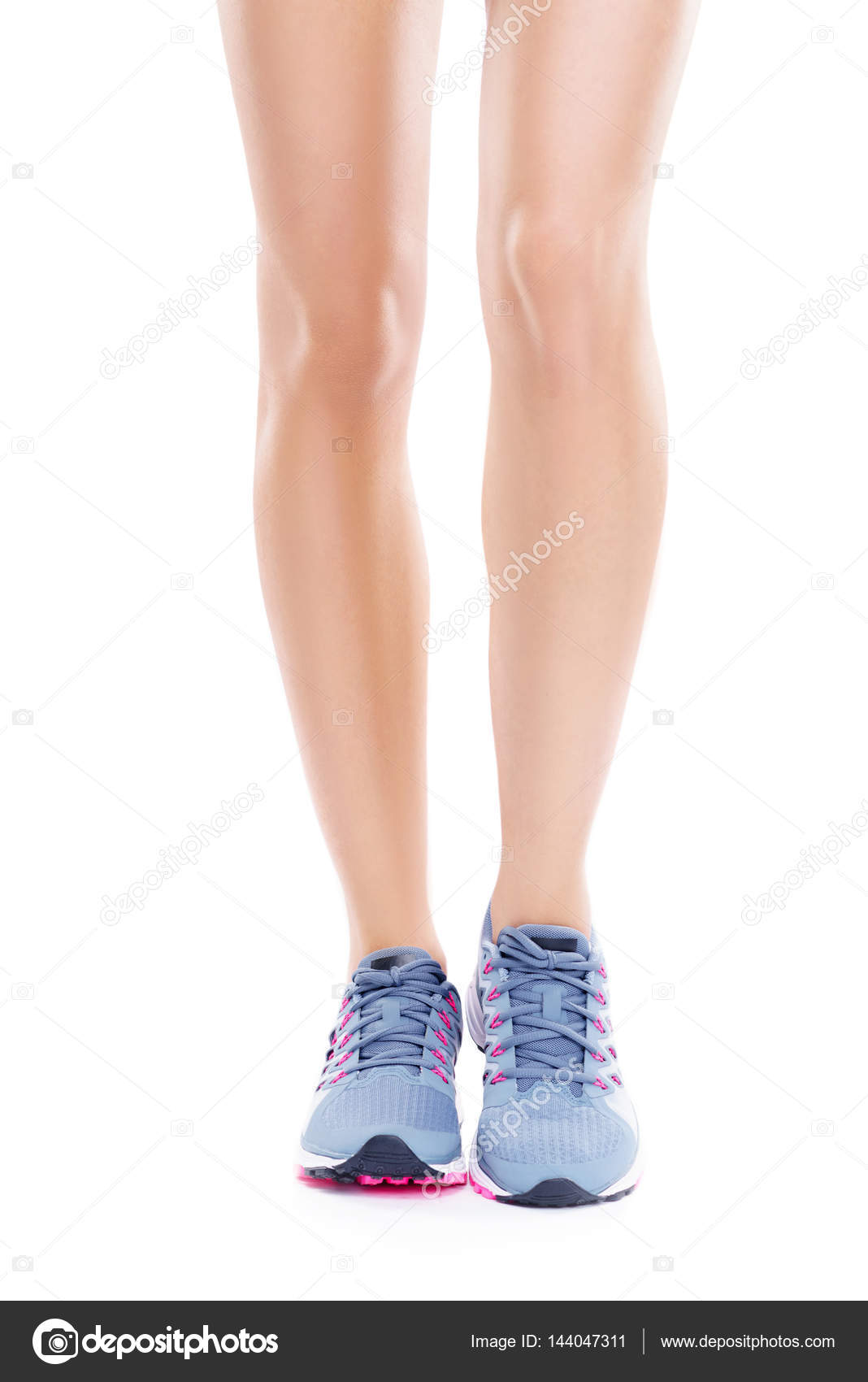 Female legs wearing running shoes — Stock Photo © shmeljov 144047311