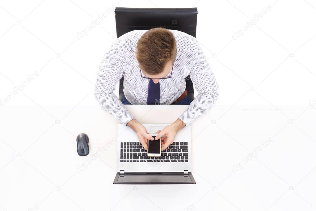 young businessman sitting at white table