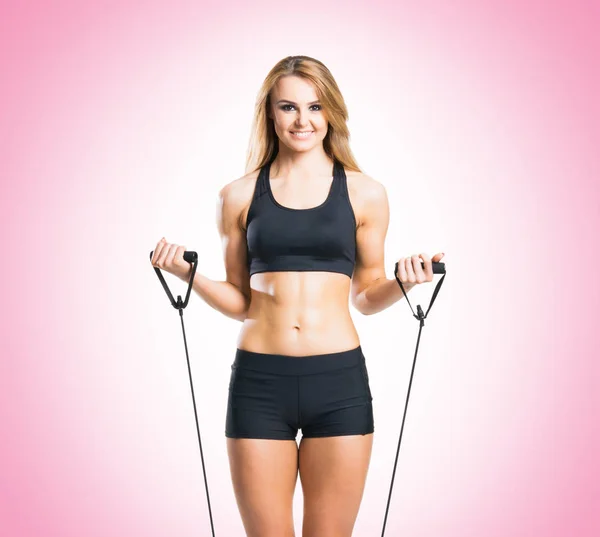 Fit young woman in black sportswear — Stock Photo, Image