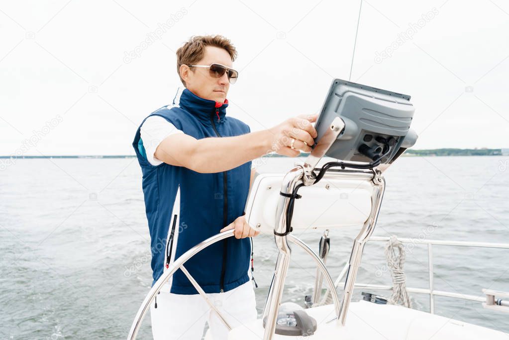 Young and handsome man on a yacht