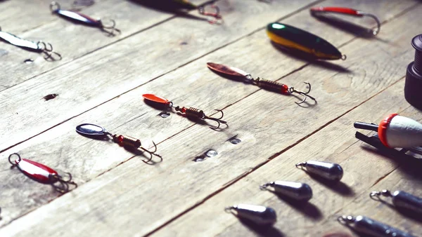 Fishing tackle on wooden planks — Stock Photo, Image