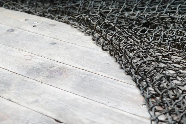 Δίχτυα αλιείας στις ξύλινες σανίδες — Φωτογραφία Αρχείου