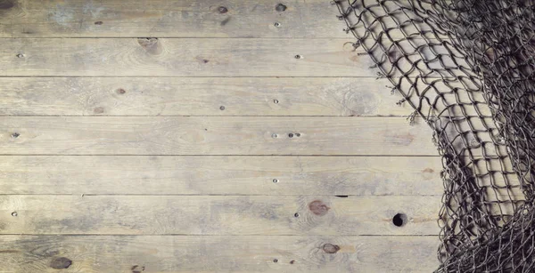 木の板に漁網 — ストック写真