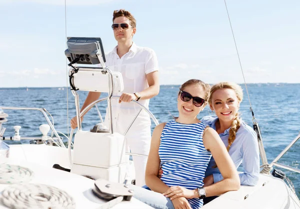 Group of happy friends traveling on a yacht — Stock Photo, Image