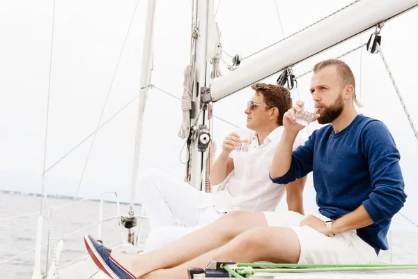 Happy friends together on a deck of a yacht — Stock Photo, Image