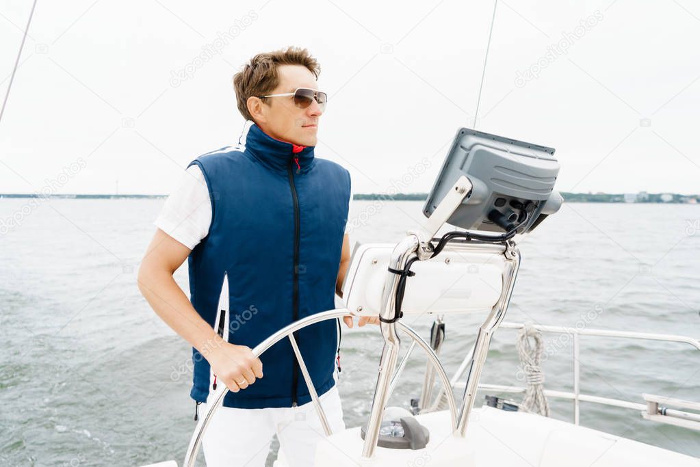 Young and handsome man on a yacht
