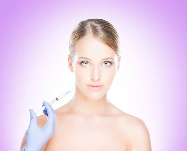 Doctor making injection into face of woman — Stock Photo, Image