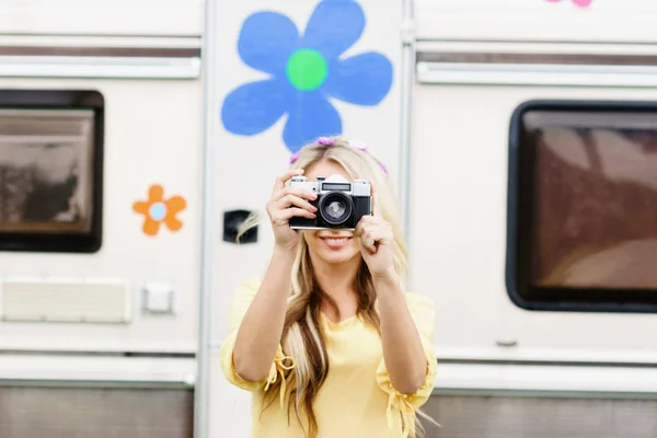 Beautiful woman taking photo with camera — Stock Photo, Image