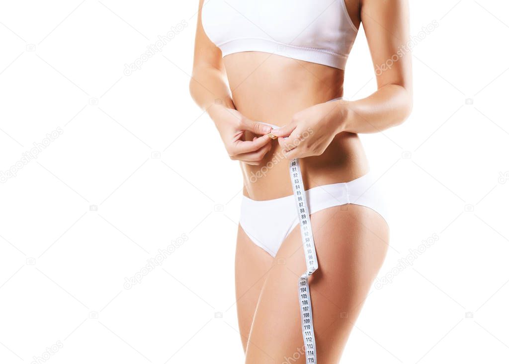 fit woman measuring body