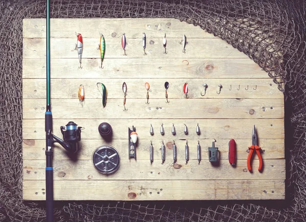 Fishing tackle on wooden planks — Stock Photo, Image