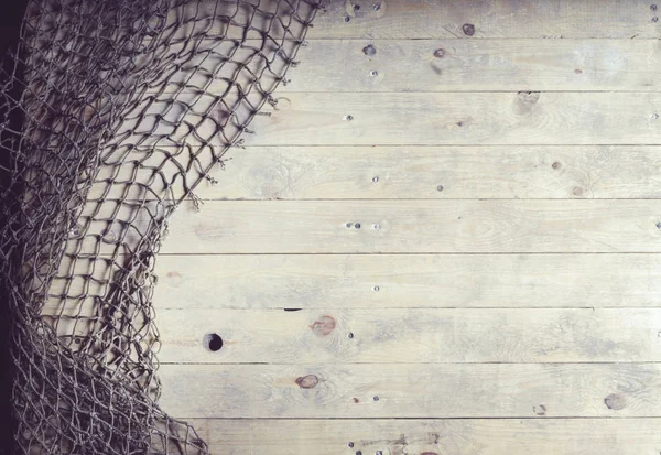 Visnetten op houten planken — Stockfoto