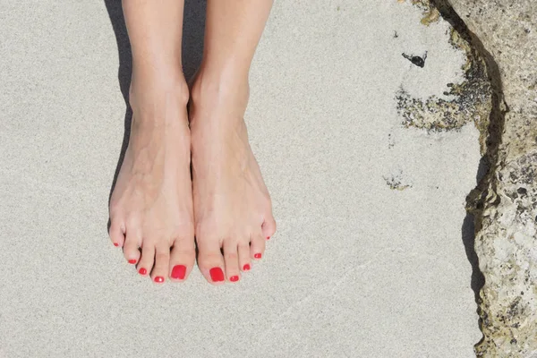 Feet with red pedicure — Stock Photo, Image