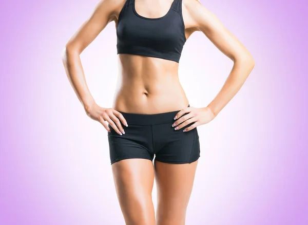 Fit young woman in black sportswear — Stock Photo, Image