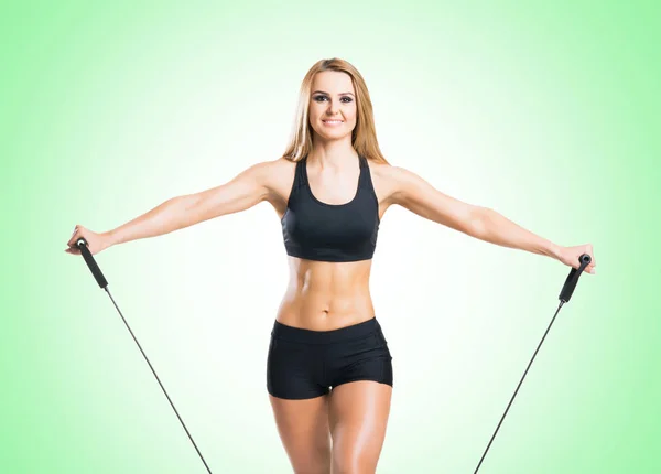 Fit young woman in black sportswear — Stock Photo, Image