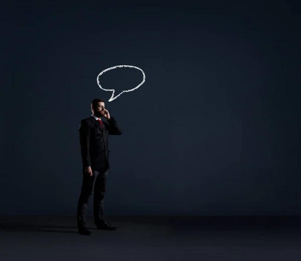 Young businessman in black suit — Stock Photo, Image