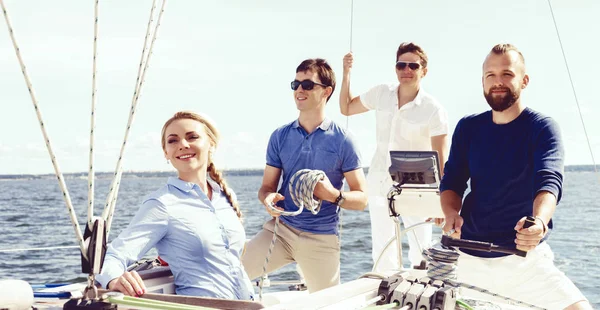 Happy friends traveling on yacht — Stock Photo, Image