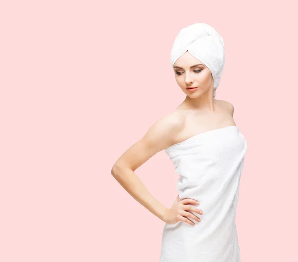 Young woman wrapped in towel — Stock Photo, Image