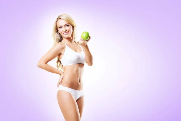 Woman in white lingerie with green apple — Stock Photo, Image