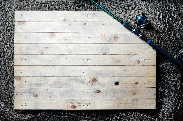 Fishing nets on wooden planks — Stock Photo, Image