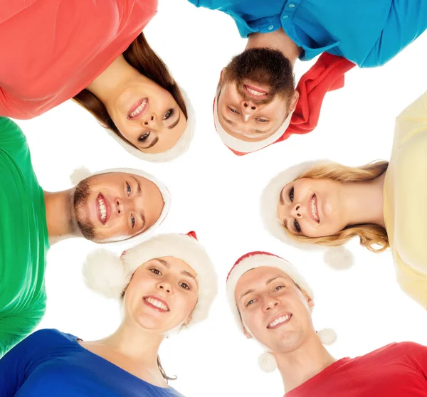 Amigos felizes em chapéus de Natal — Fotografia de Stock