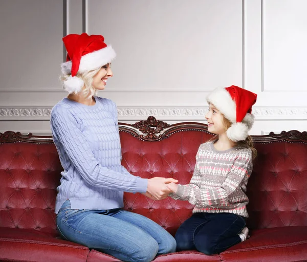 Mother and daughter celebrating Christmas at home — Stock Photo, Image